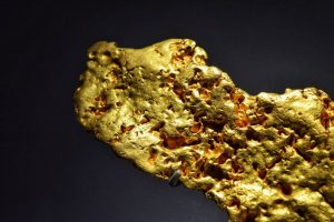 gold influencers - a close up of a gold nugget